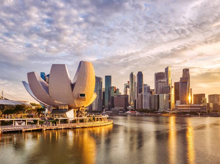 Smart sustainable city with green spaces, advanced public transport, and eco-friendly urban planning at sunset